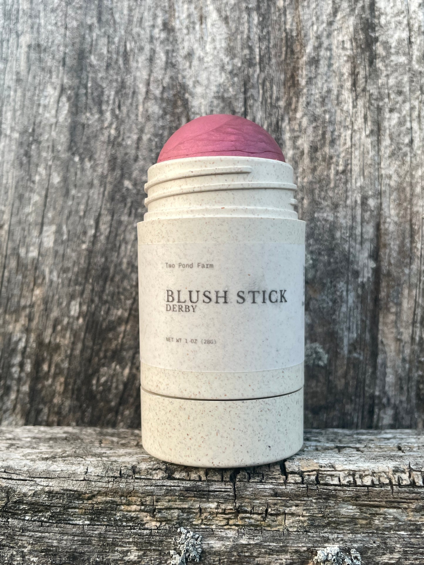 Blush stick tube - Derby
Wooden background