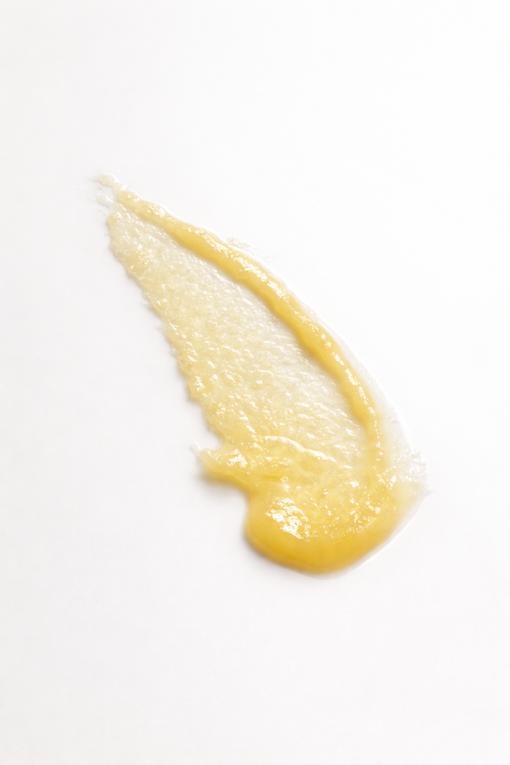 Yellow cream swatch on a white background